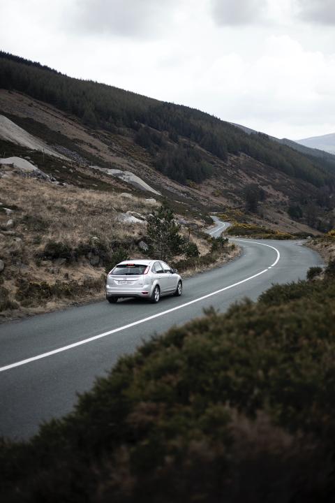 car driving down road