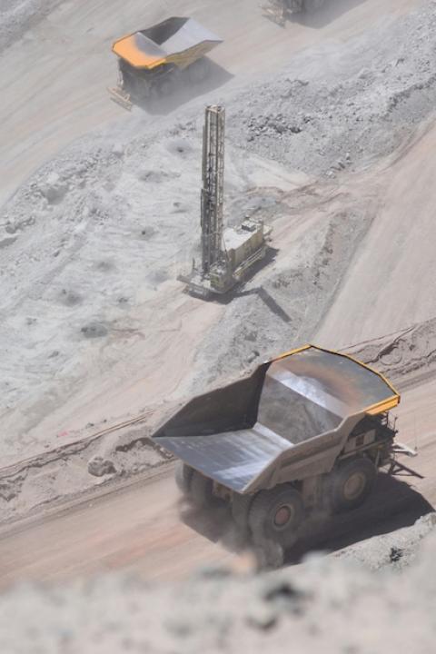 Dump trucks at the Chuquicamata mine in Chile — mining taxes