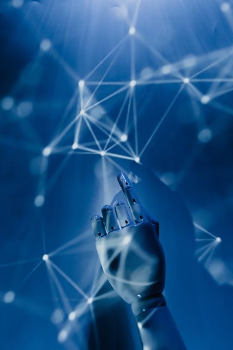 robot hand reaching into web of data - AI