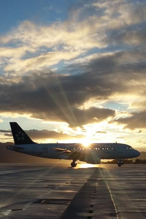 A plane on tarmac - sustainable aviation fuel 