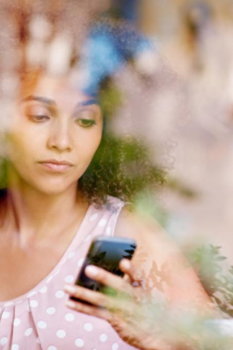 Womanwithphonecafe.jpeg