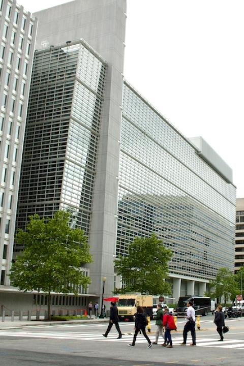 People walking across the street toward The World Bank Group headquarters in Washington D.C. — Approach to Responsible Exit