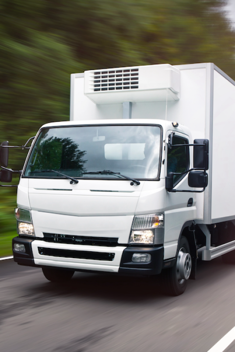 box truck on highway with trees in background - fueling for fleets